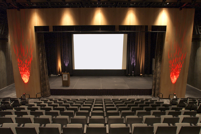 the Barney Danson Theatre in the Canadian War Museum in Ottawa is a large auditorium with rows of chairs.