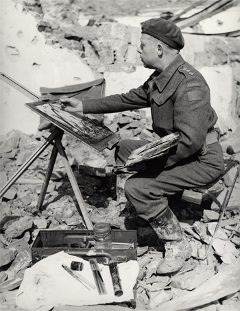 A man sitting in front of rubble, painting with an easel.