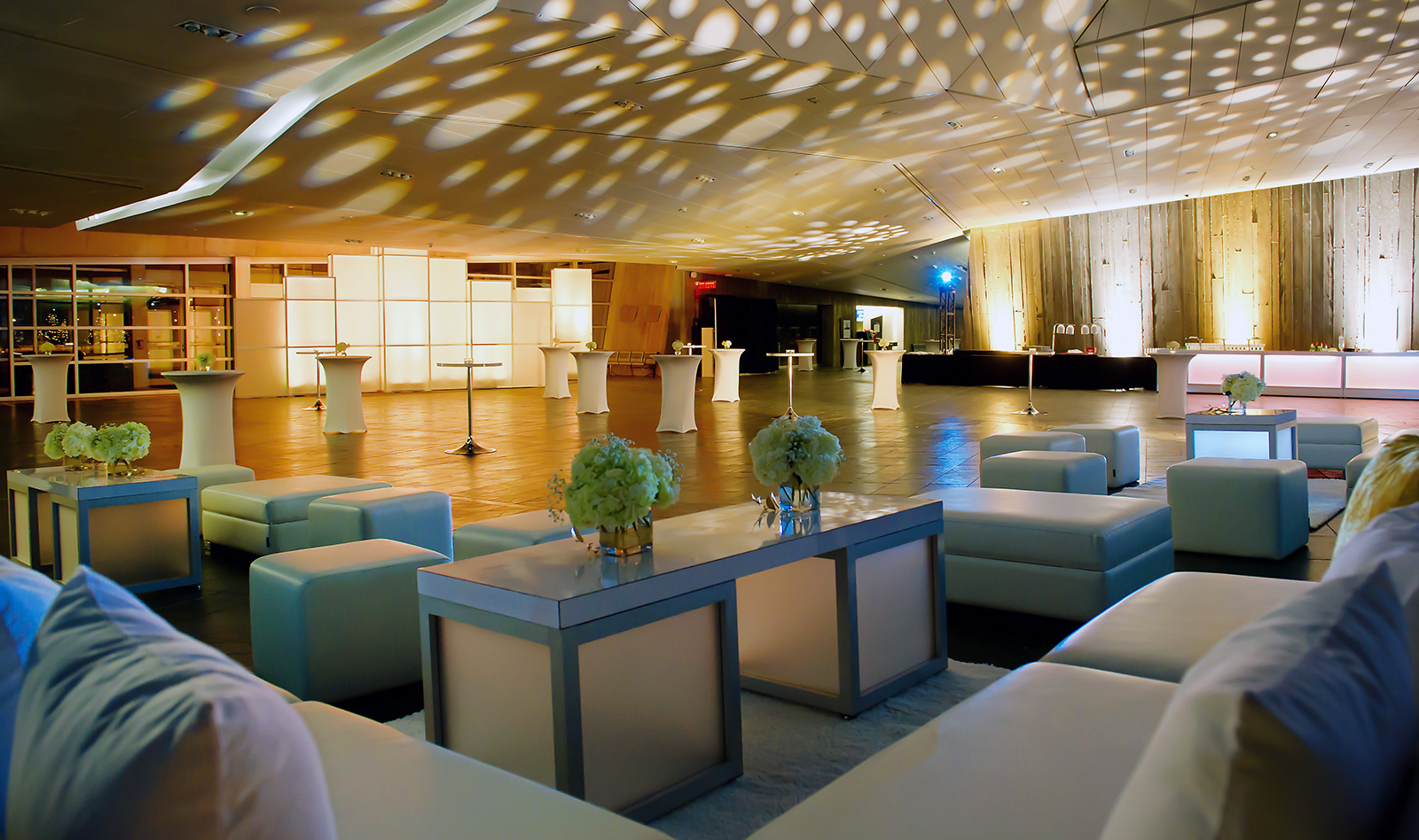 A large room with couches and tables in Ottawa at the Canadian War Museum.