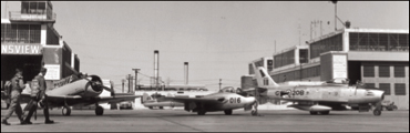 Second World War planes at an airfield.