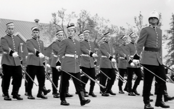 A group of men in uniform on display at the Royal Military College.