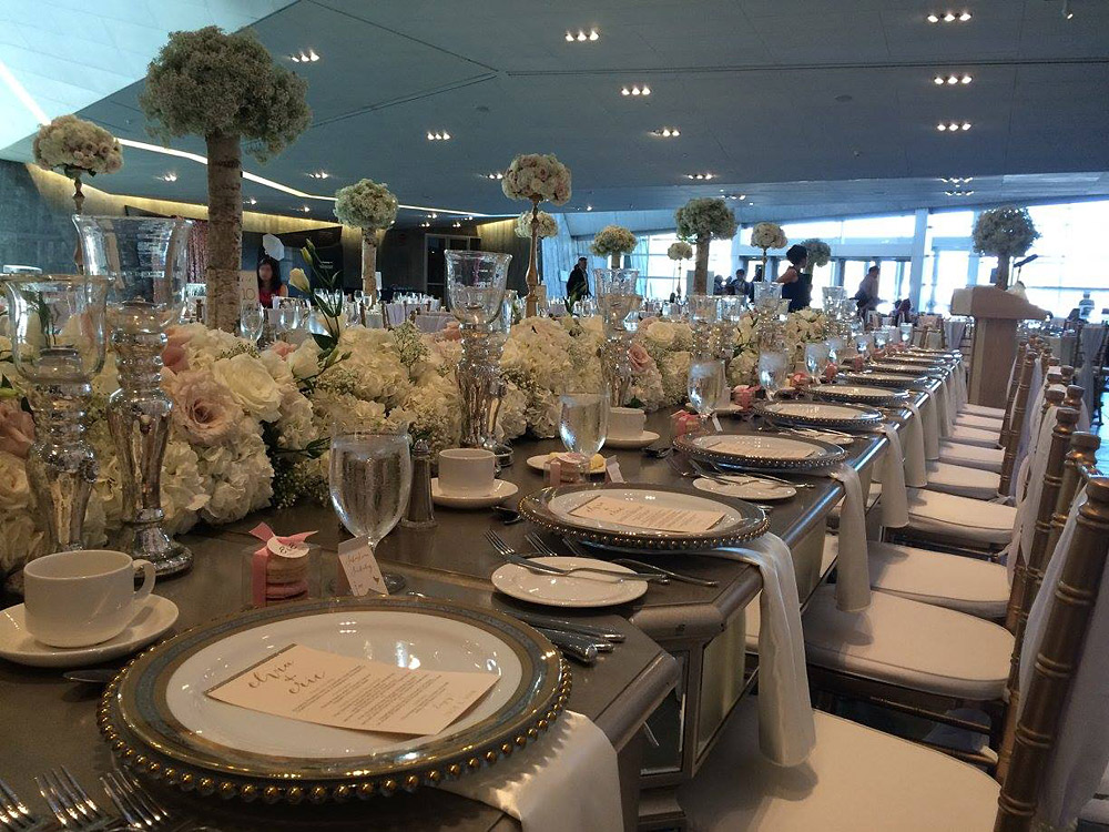 A long table at the Canadian War Museum in Ottawa is set with white plates and silverware.