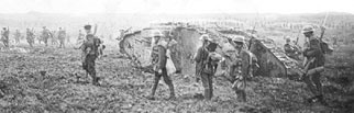 A group of soldiers standing near a tank at Vimy Ridge.