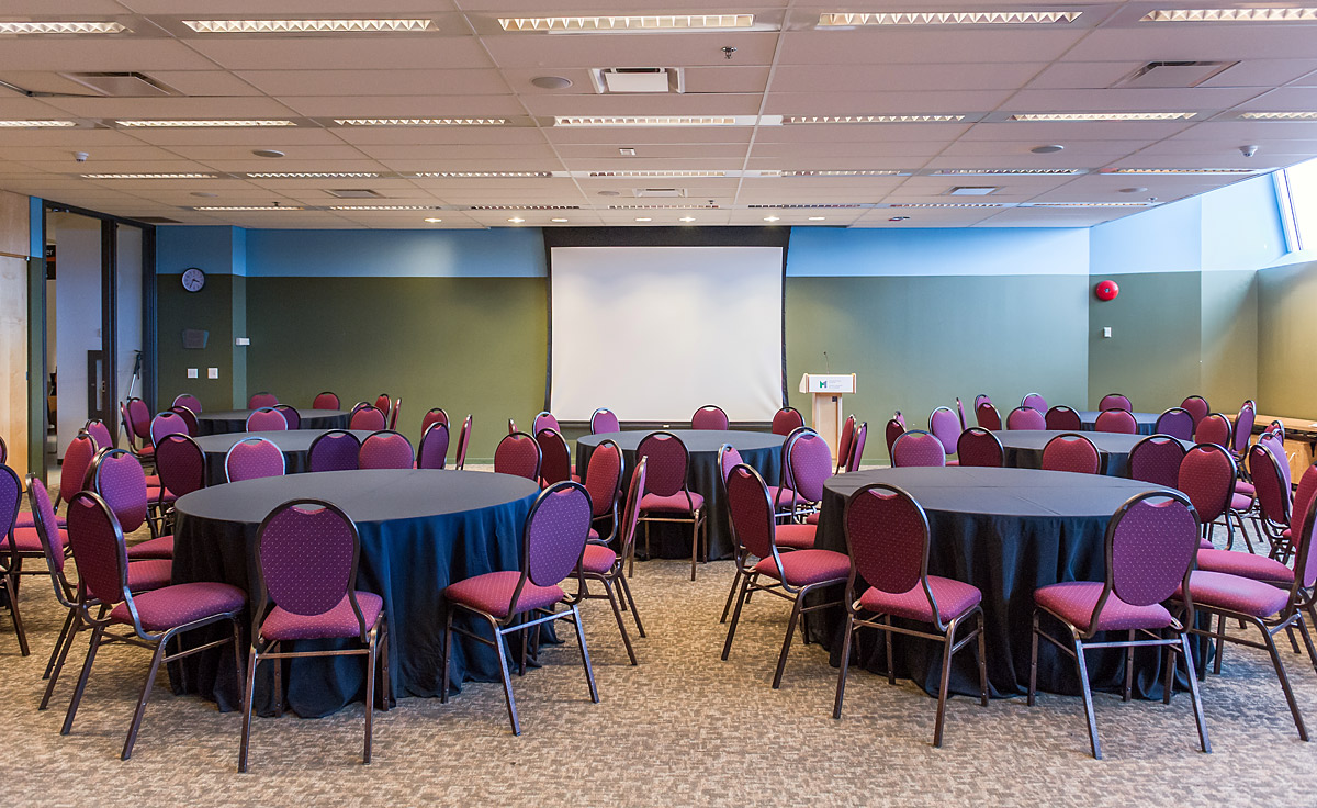 A conference room with tables and chairs set up at the Canadian War Museum in Ottawa.