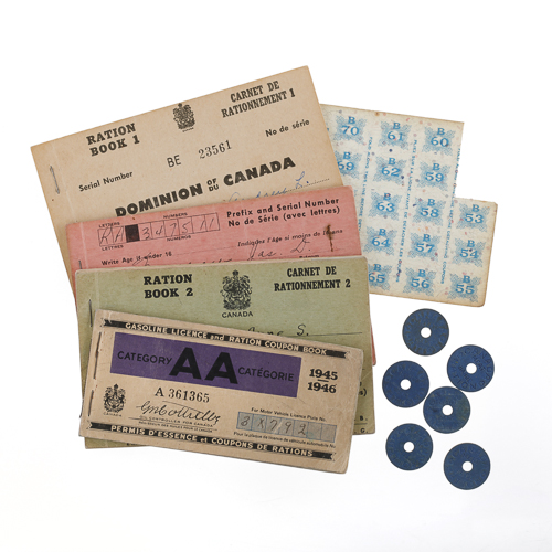 A group of old tickets and other items on a white surface at the Canadian War Museum in Ottawa.