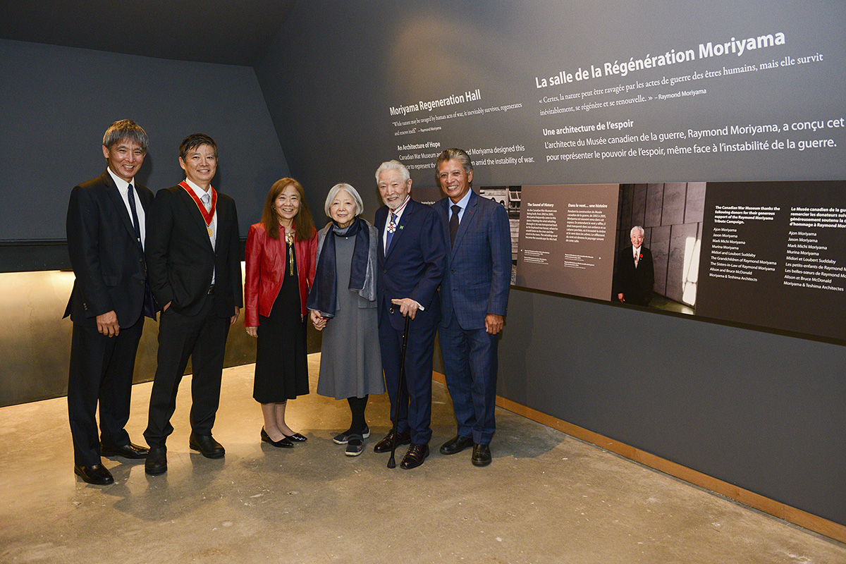 A group of people standing in front of a wall at the Canadian War Museum in Ottawa.