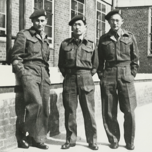 Three men in uniform standing in front of the Canadian War Museum in Ottawa.