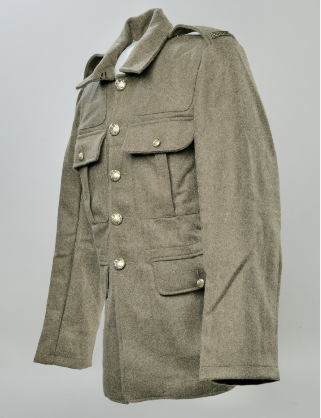 A wwii uniform with buttons on the front.