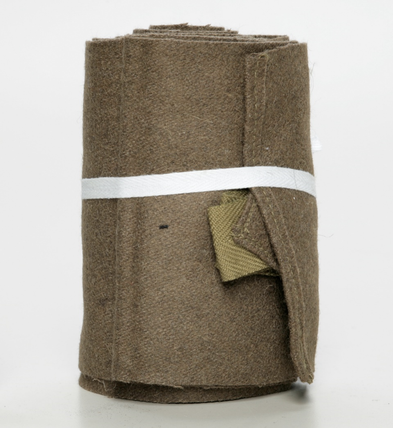 A roll of brown cloth with a label on it.