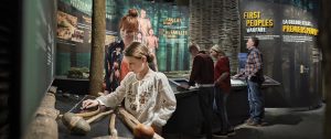 A group of people looking at exhibits in the Canadian War Museum in Ottawa.