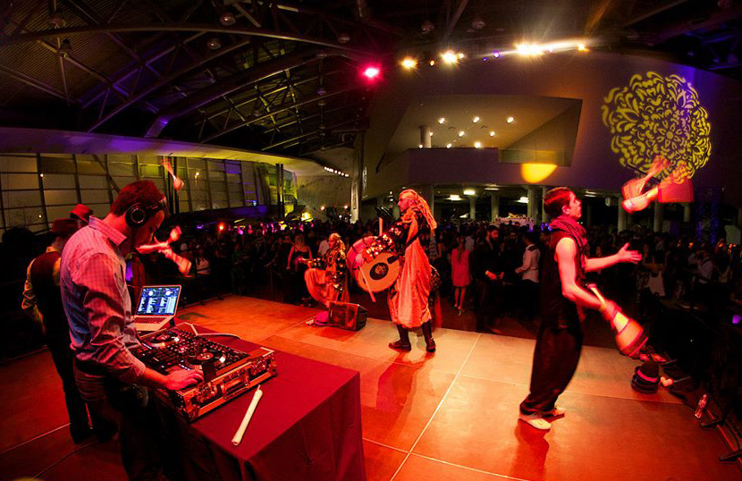 A group of people dance at an event in the LeBreton Gallery in Ottawa.