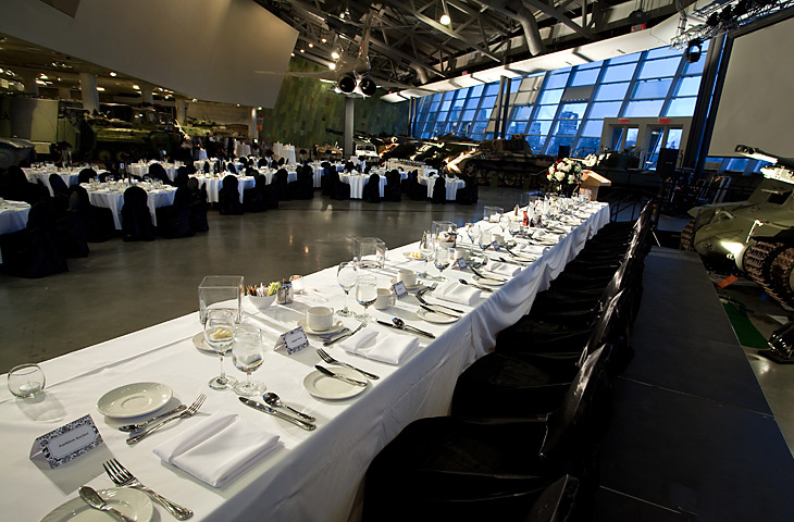 A long table with white linens in the LeBreton Gallery at the Canadian War Museum, Ottawa.