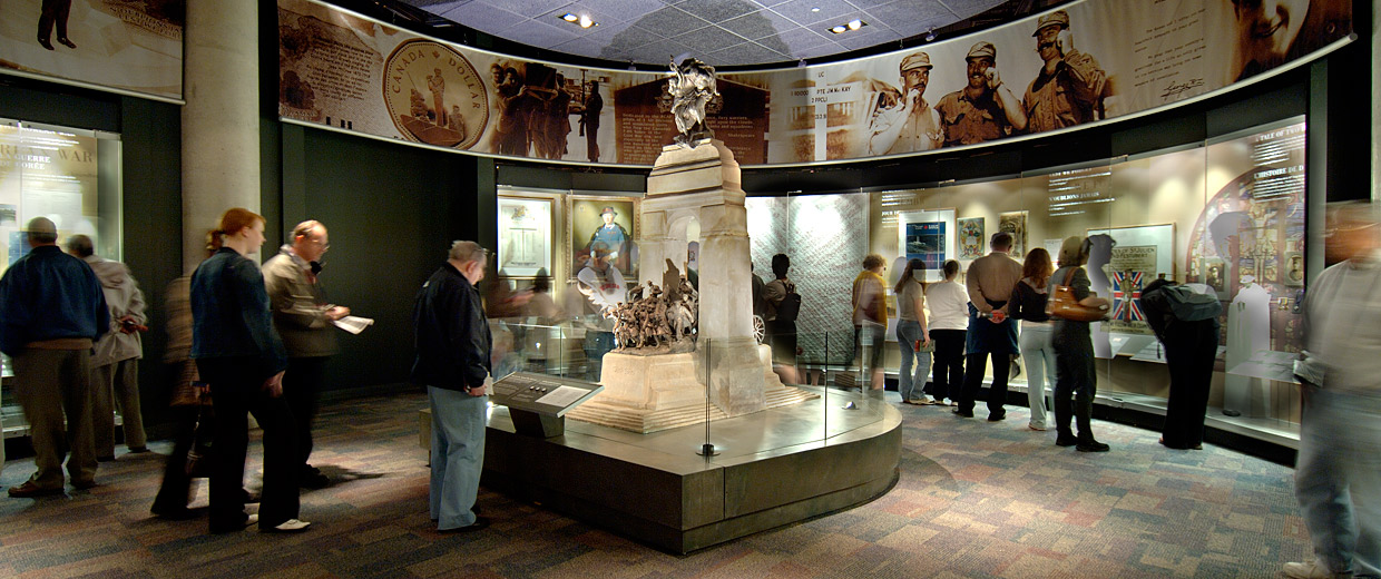 A group of people looking at a statue in the Canadian War Museum in Ottawa.