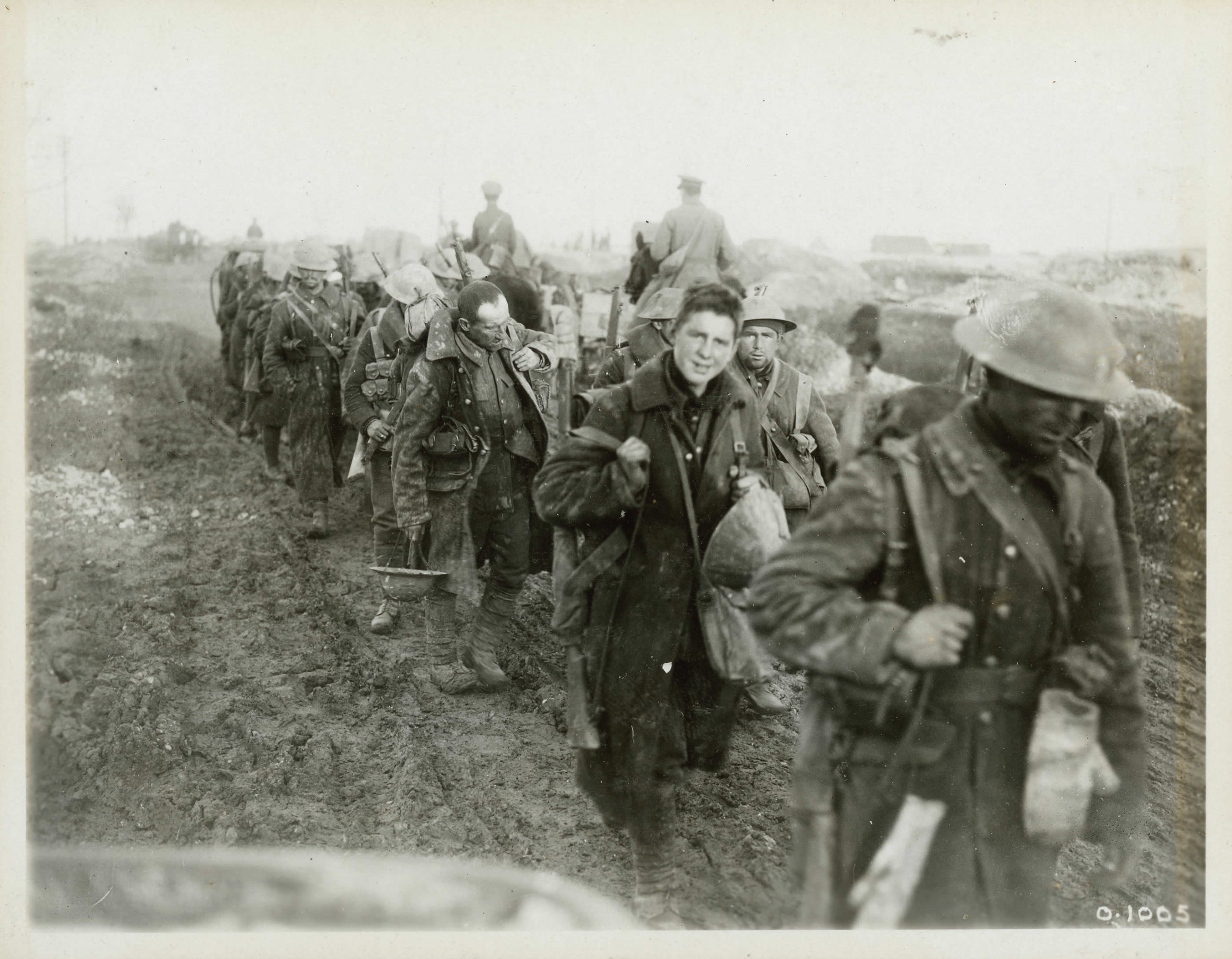 A group of soldiers from the Canadian War Museum walking down a dirt road in Ottawa.