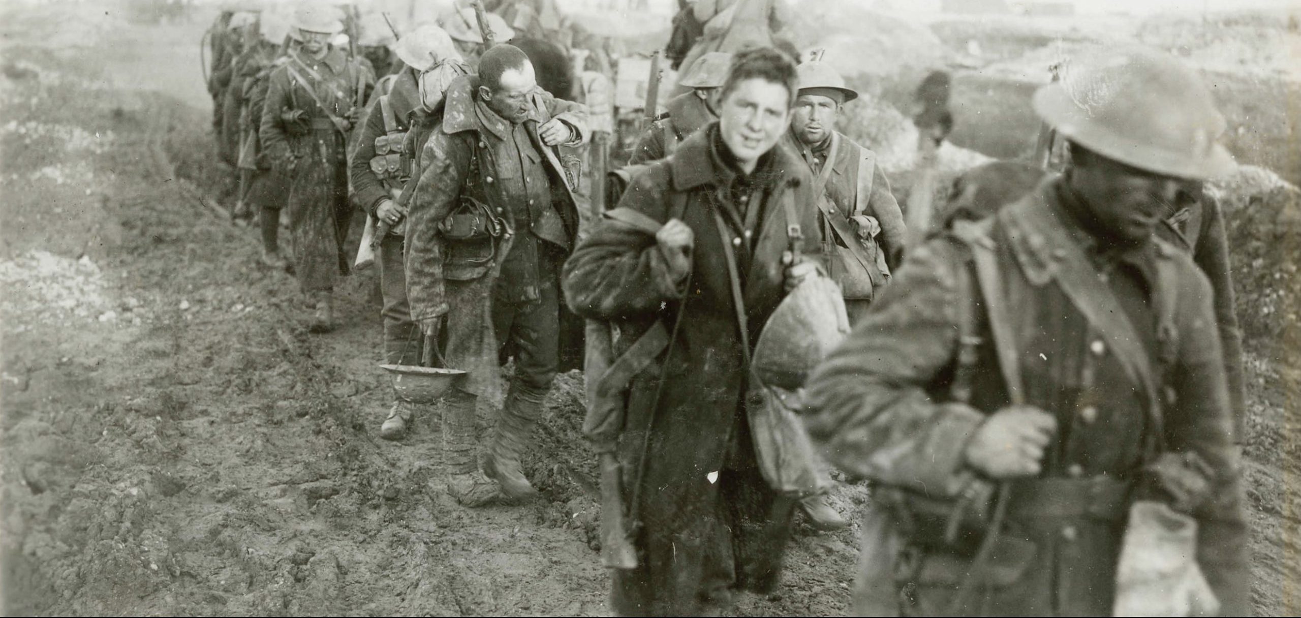 A group of soldiers from the Canadian War Museum walking down a dirt road in Ottawa.