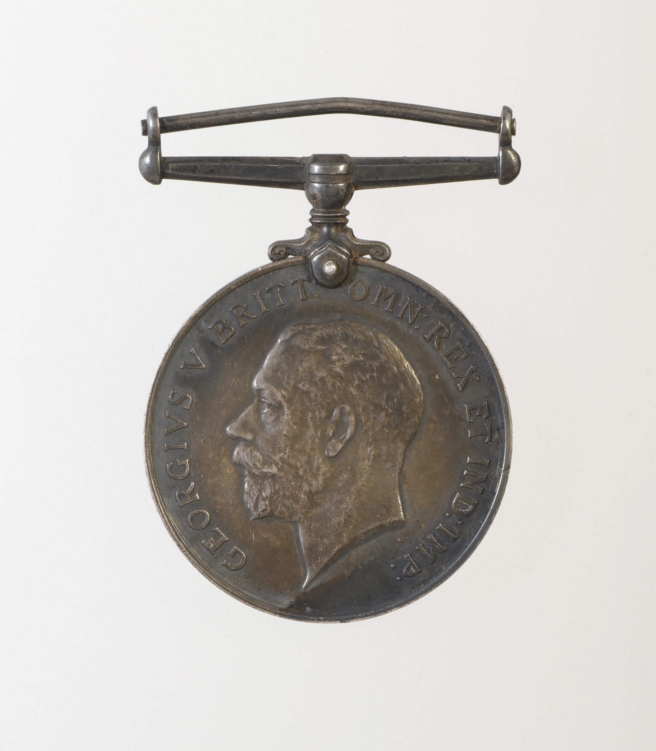 A bronze medal featuring a portrait of King Edward VII, displayed at the Canadian War Museum in Ottawa.