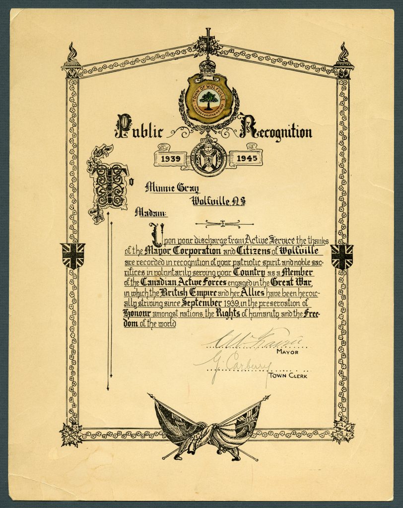 A certificate with an ornate design on it, awarded to Minnie Gray.