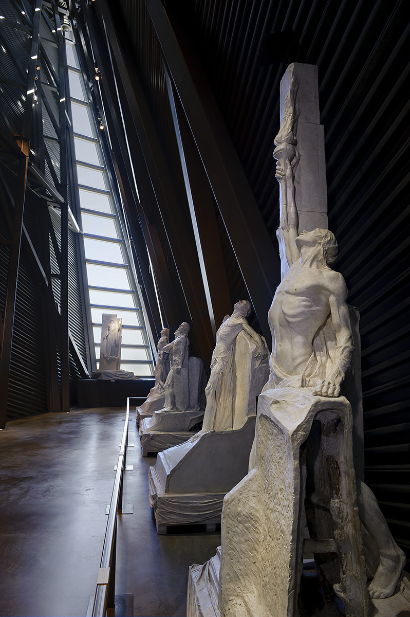 A group of statues in a museum.